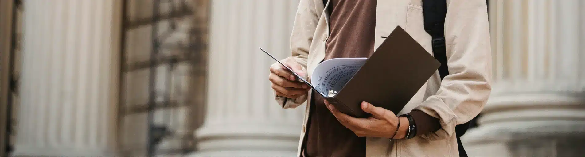 person holding documents person holding documents