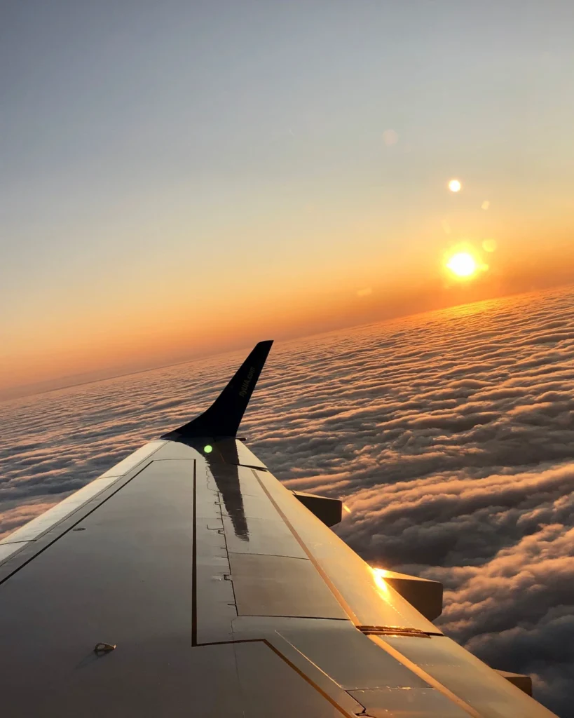 plane wing sunset sky